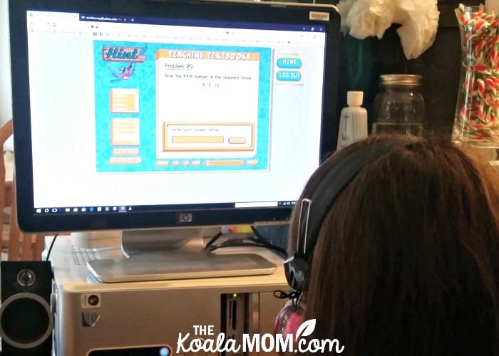 Sunshine doing her online homeschool math curriculum