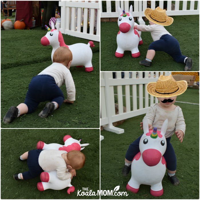 Baby riding a bouncy unicorn at Harvest Glow.