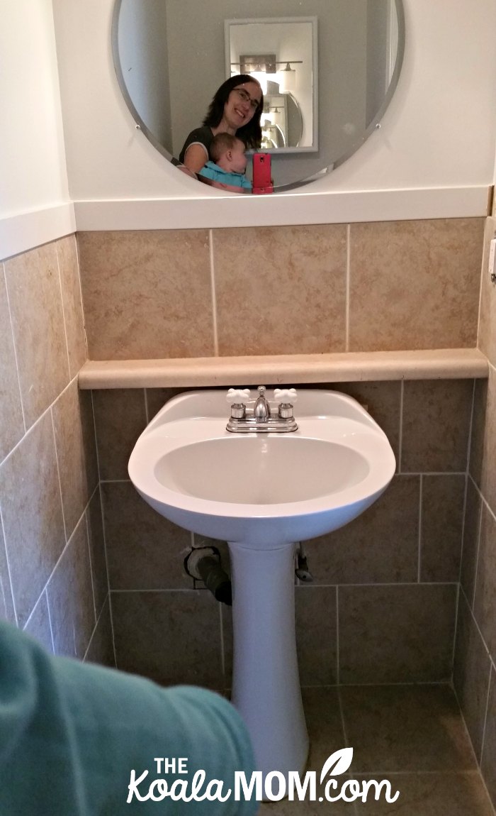 Ensuite Bathroom Makeover - the before picture!!! Tiles halfway up the walls, white pedestal sink, round mirror.