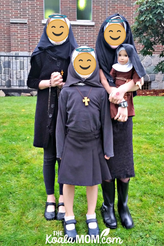 Three girls dressed up as nuns for our Canadian All Saints Day Party.