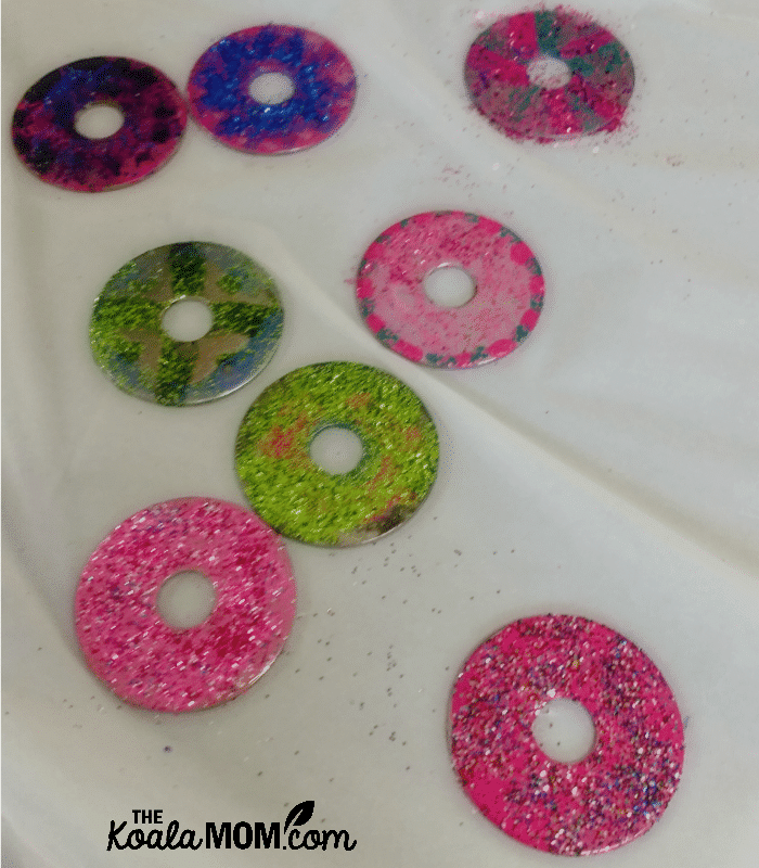 Washers decorated with nail polish and glitter for the St. Joseph medal craft at our Canadian All Saints Day Party