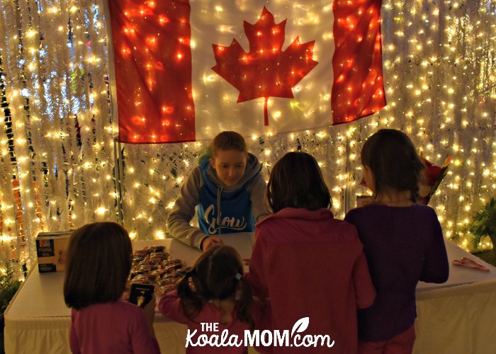 Claiming maze prizes at the Canada booth at Christmas Glow.