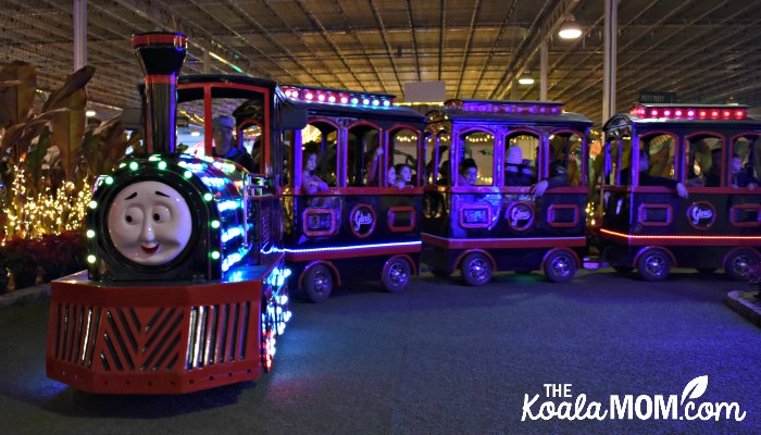 Children riding the Glowcomotive at Christmas Glow in Langley.