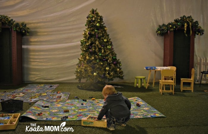 Toddler play area with cars, colouring, and more at Christmas Glow.