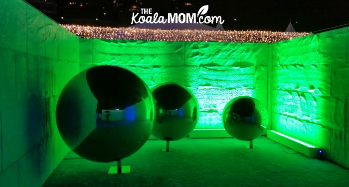 Green reflecting balls in the winter maze at the Aurora Winter Festival in downtown Vancouver.