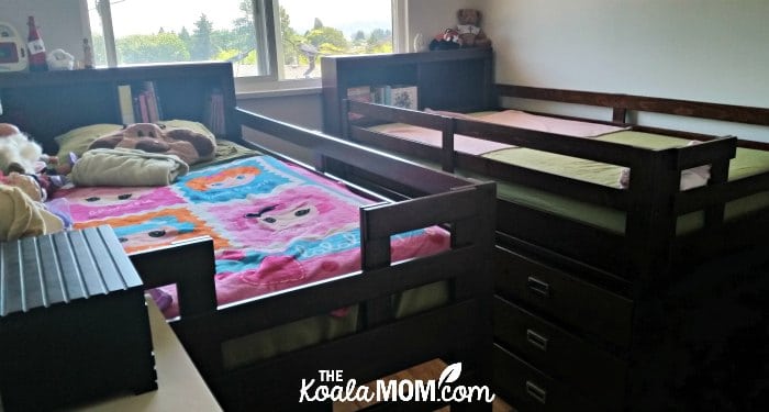 Two loft beds in a room.