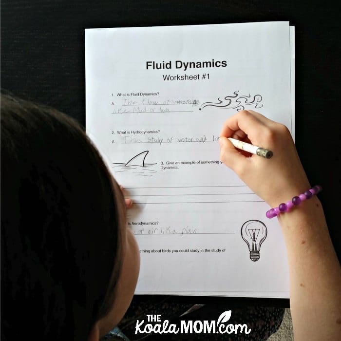 Sunshine completing her fluid dynamics worksheet from CrossWired Science.