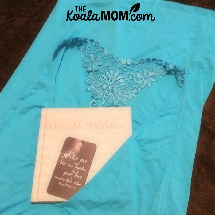 Pretty blue lingerie with a book on sensual massage for a hot night with your hubby.