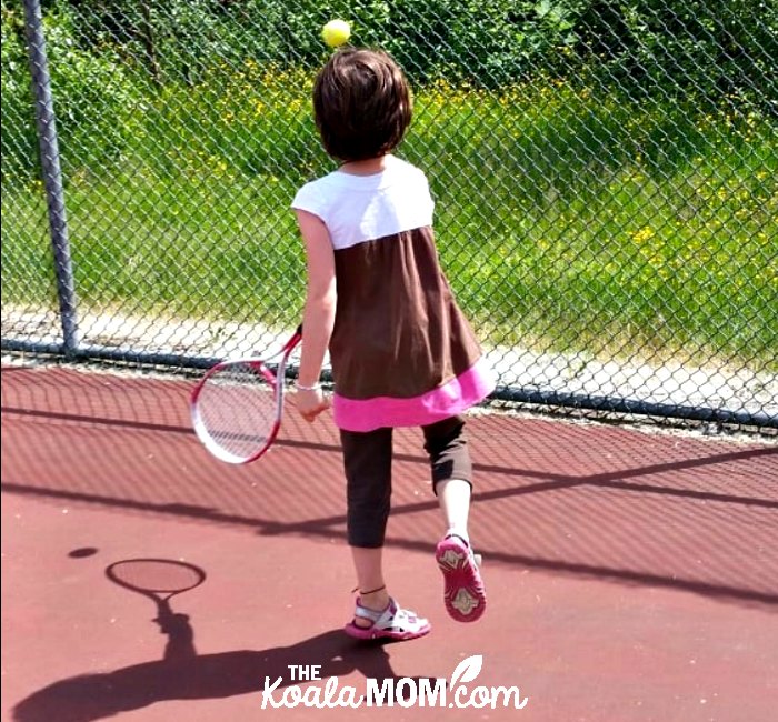 Girl playing tennis, a great free recreational activity around greater Vancouver.