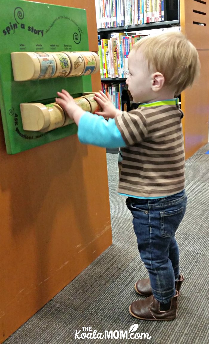 Baby playing at library.