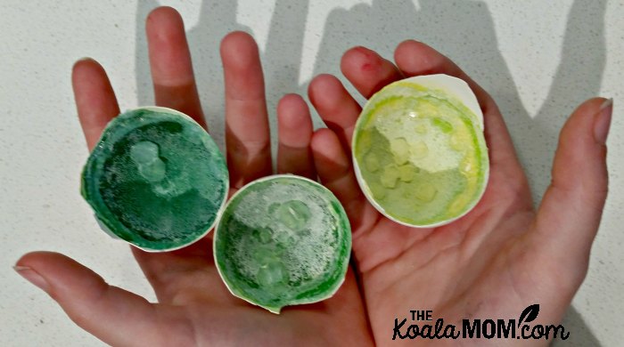 Child holding her eggshell geode science experiment.