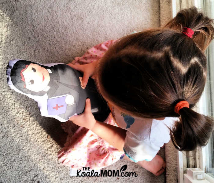 3-year-old holding a St Elizabeth Ann Seton doll