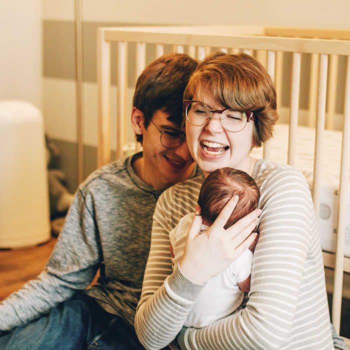 Catholic mom blogger Chloe Langr with her husband and baby daughter