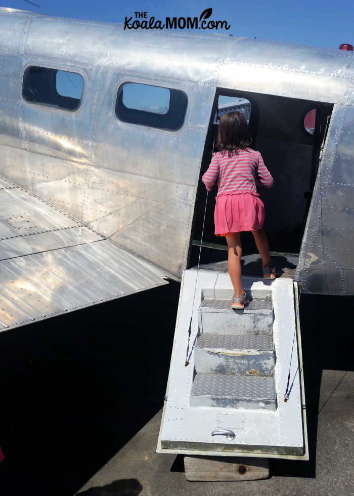 6-year-old Jade exploring a historic plane.