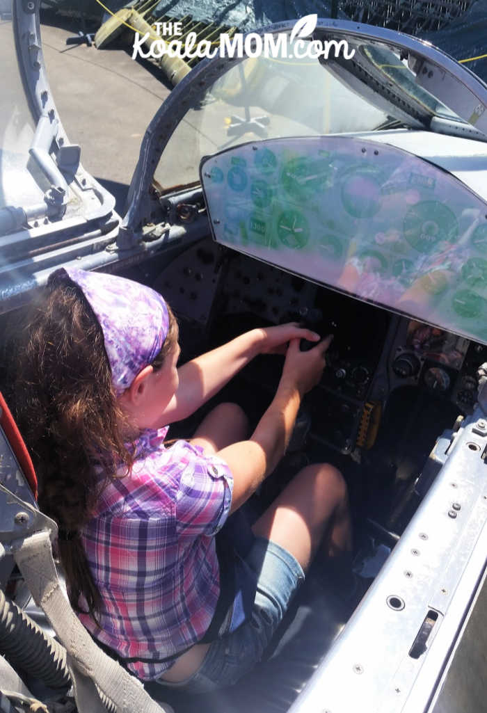 Sunshine pretending to be a fighter pilot in a World War 2 plane.