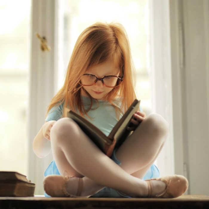 Girl reading a book. Photo by Andrea Piacquadio from Pexels
