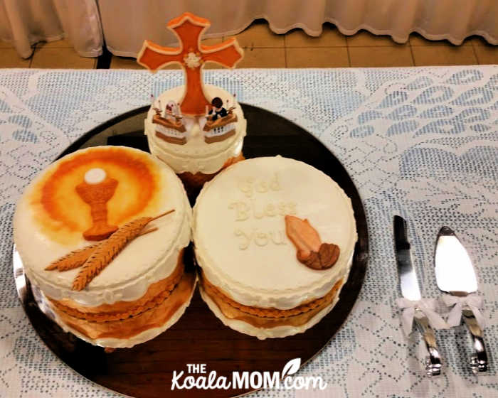 First Communion Cake with cross, "God Bless You," children kneeling at communion rails.