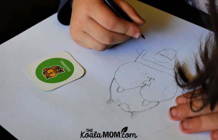 Preschooler drawing a squirrel.