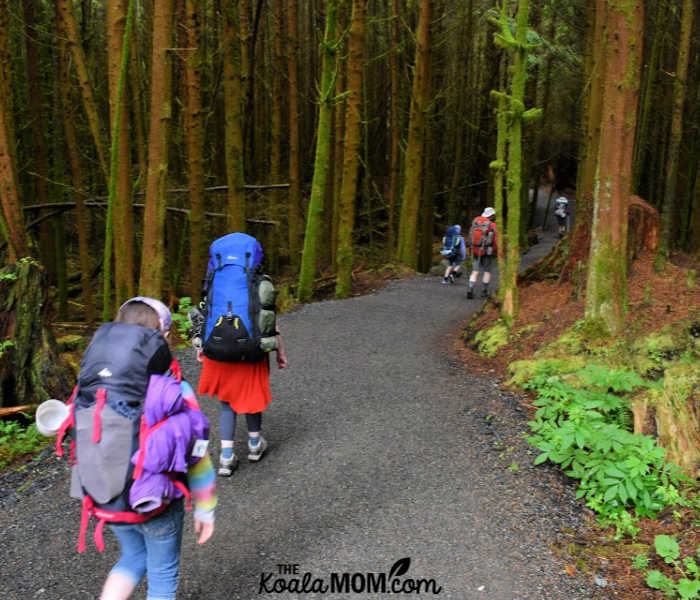 Hikers heading down the trail toward Sombrio Beach.