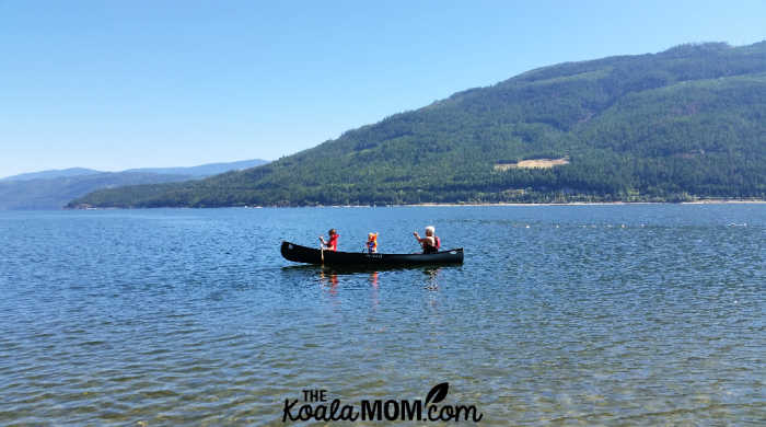 7-year-old and 2-year-old in a canoe on Shuswap Lake with their grandma.