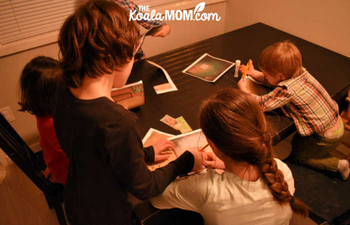 Sisters working on a printable escape room game challenge together.