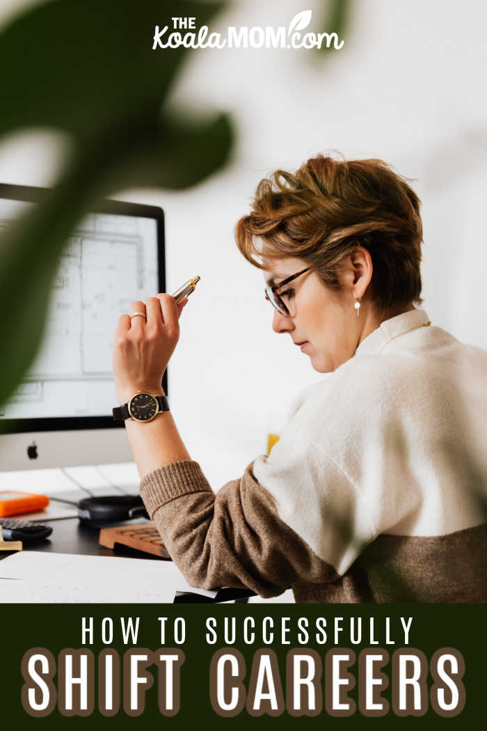 A woman sits at her computer with a pen in hand and notebooks on her desk, considering how to shift her career.