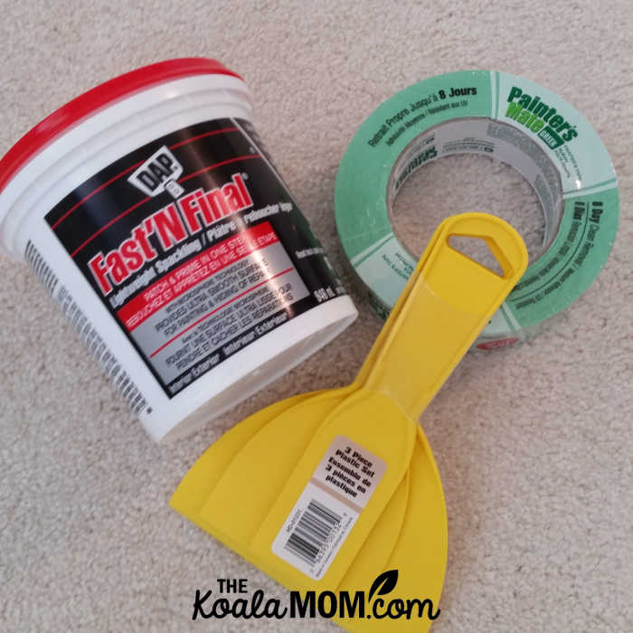 Spackling or "dap," trowels, and painters tape for repairing drywall.