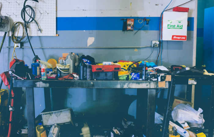 9 Signs That You're Living in a Cluttered Home - you can't fit your car into your garage, like this cluttered garage.