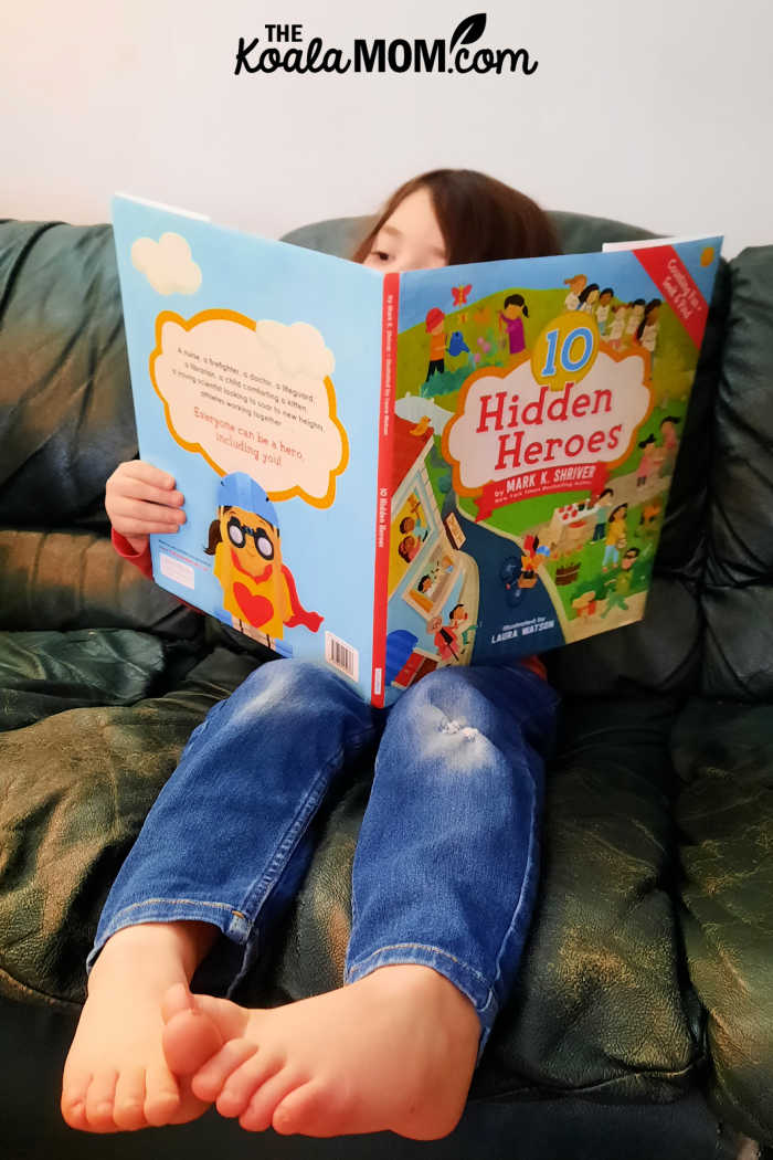 5-year-old reads 10 Hidden Heroes by Mark K. Shriver.