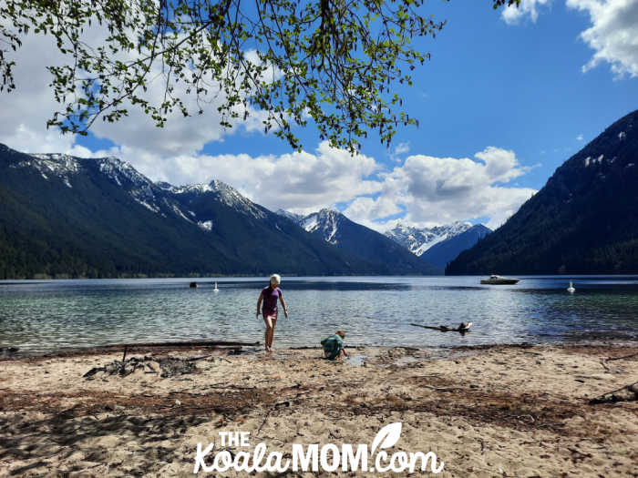 Two siblings playing on the beach at Chilliwack Lake.