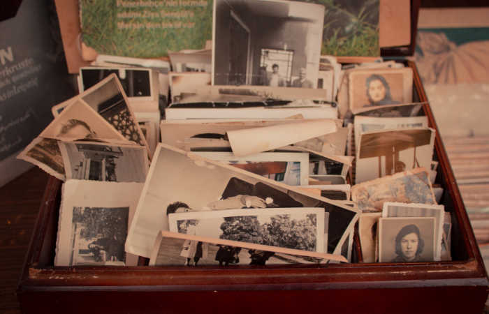 A box of black-and-white family photos.