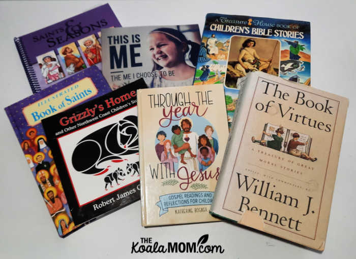 The books we are currently using in our morning basket time, including William Bennet's Book of Virtues, a children's bible, saint anthology, etc.