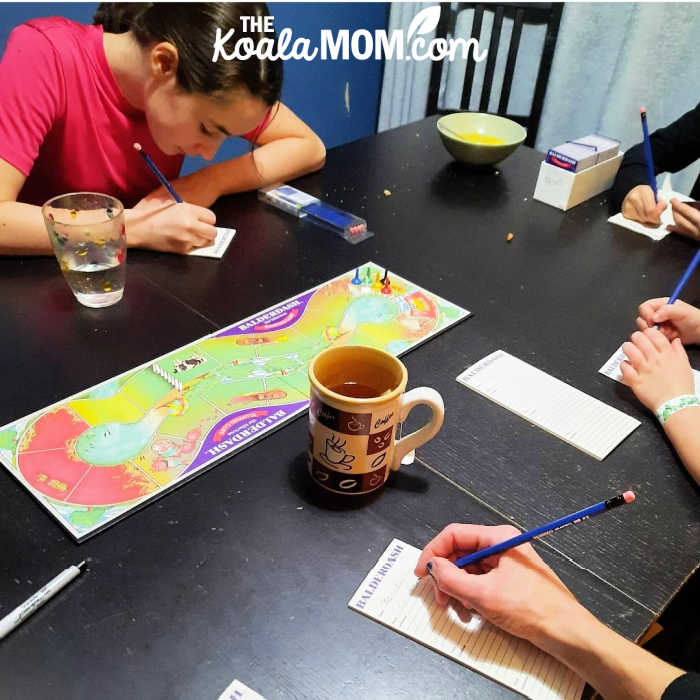 Family playing Balderdash together.