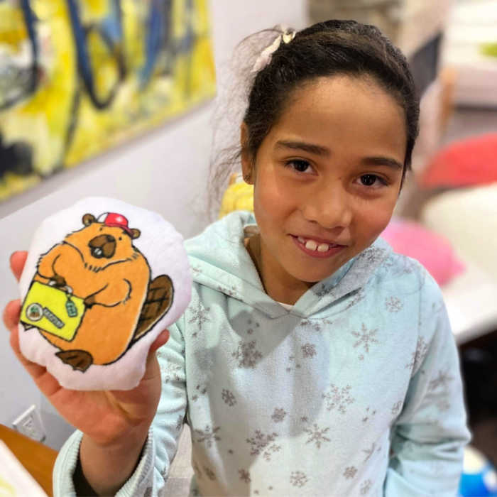 Girl with Patrick, the Canadian beaver who joins her on her travels. Photo courtesy of Darya Yatskova..