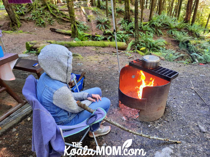 Teen watching the campfire.