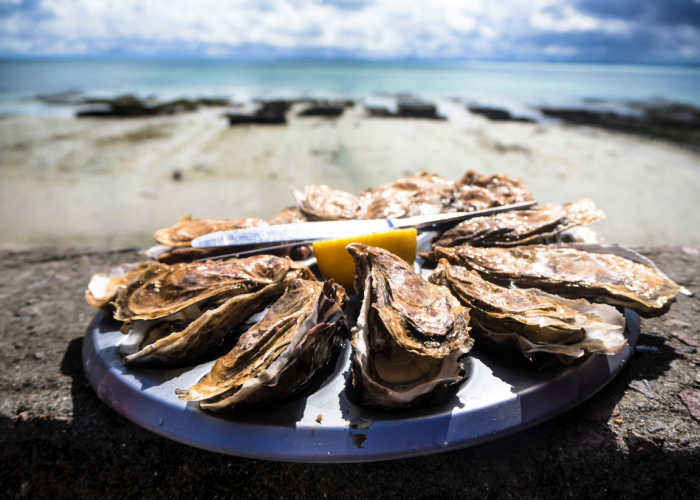 Cooked seafood on a round place. Photo by Tommaso Cantelli on Unsplash