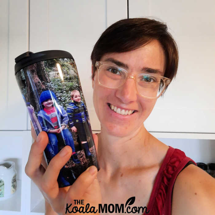 Bonnie Way holds her custom photo travel mug.