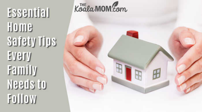 Essential Home Safety Tips Every Family Needs To Follow. Photo of hands around model house via Depositphotos.