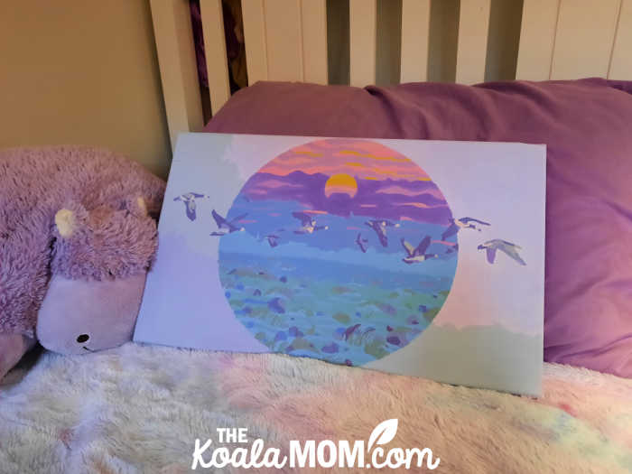 Completed Lex Zooz purple geese sunset paint-by-number painting from Craft-Ease.