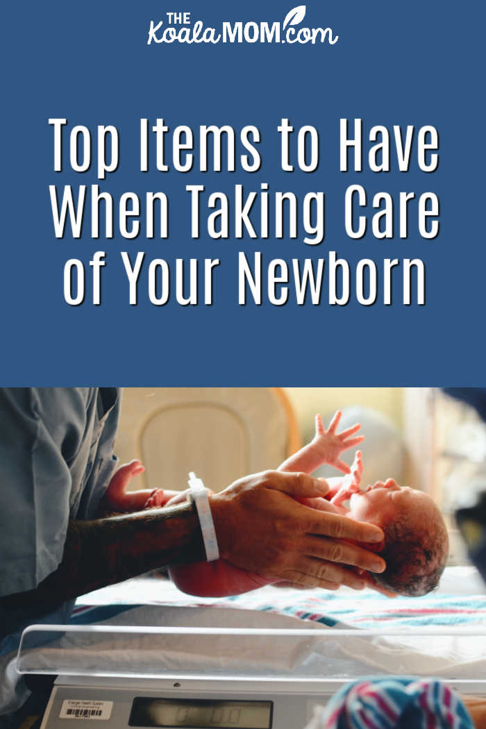 Top Items to Have When Taking Care of Your Newborn. Photo of doctor holding a newborn over a scale by Christian Bowen on Unsplash