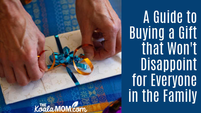 A Guide to Buying a Gift that Won't Disappoint for Everyone in the Family. Photo of person wrapping present in blue paper by Ivan on Unsplash