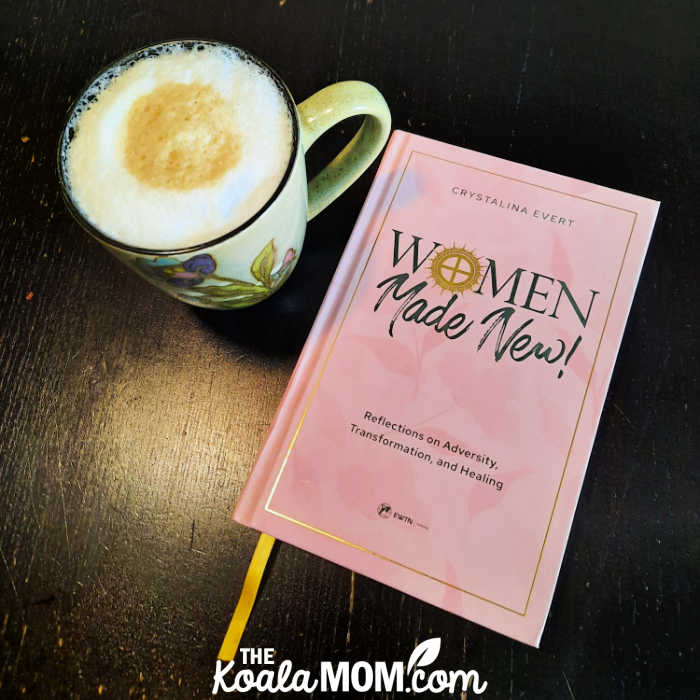 Women Made New: Reflections on Adversity, Transformation, and Healing by Crystalina Evert, sitting beside a cup of coffee.