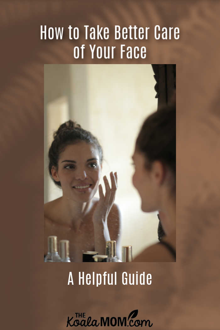 How To Take Better Care Of Your Face: A Helpful Guide. Photo of woman looking in mirror by Andrea Piacquadio via Pexels.