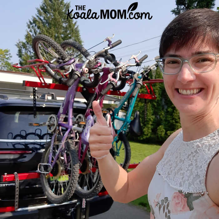 Happy mom giving her VelociRAX bike rack a thumbs-up.