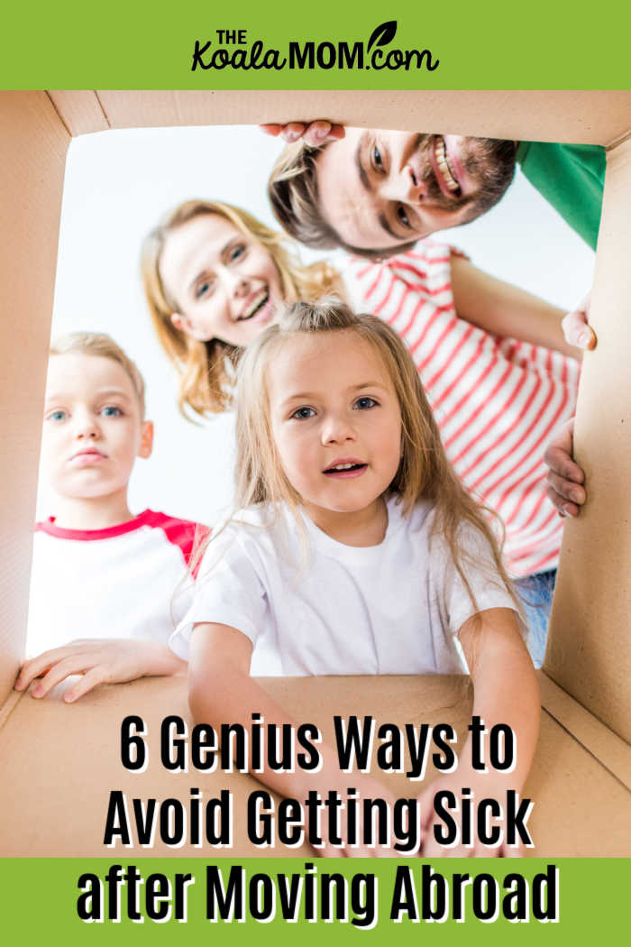 6 Genius Ways to Avoid Getting Sick after Moving Abroad. Photo of happily family of four peering into moving box via Depositphotos.