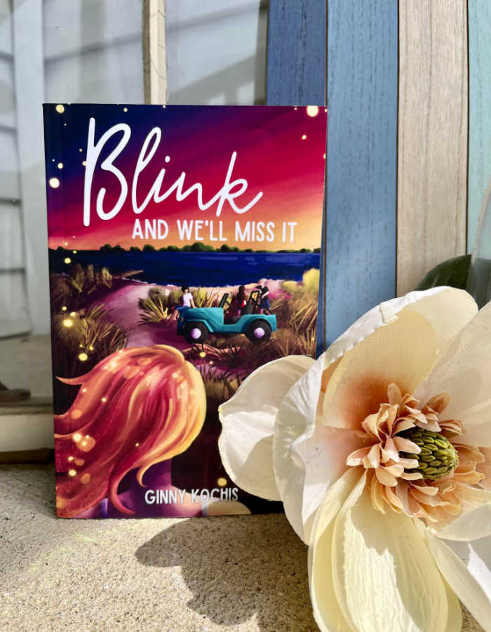 Blink and We'll Miss It (paperback novel sitting with a flower)