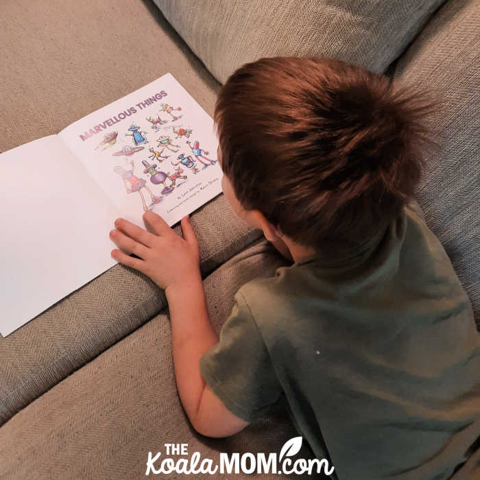 Boy laying on couch reaching Marvelous Things by Lynn Johnston.