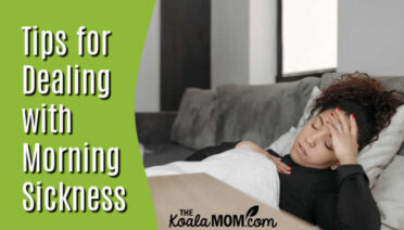 Tips for Dealing with Morning Sickness. Photo of pregnant woman in bed holding her head.