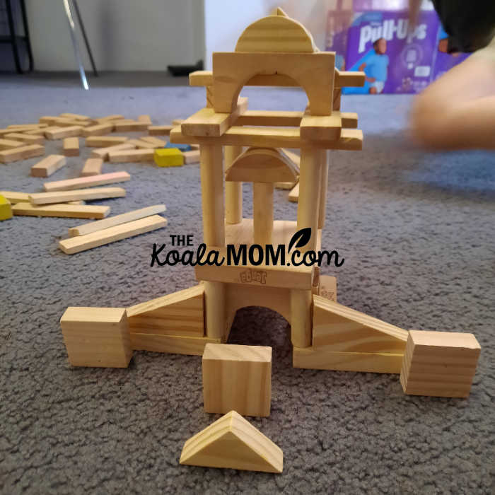 Wooden blocks stacked up like a tower.