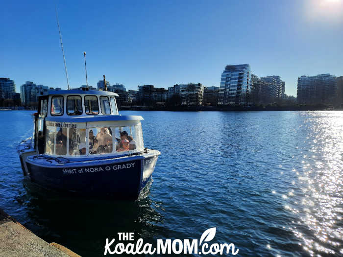 A blue False Creek Ferry pulls up to the ferry dock. Photo by Bonnie Way.